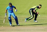 HAMILTON, NEW ZEALAND - MARCH 10:  John Mooney of Ireland drops a catch as Rohit Sharma of India sets off for a run during the 2015 ICC Cricket World Cup match between Ireland and India at Seddon Park on March 10, 2015 in Hamilton, New Zealand.  (Photo by Hannah Peters/Getty Images)